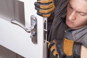 Locksmith repairing broken lock